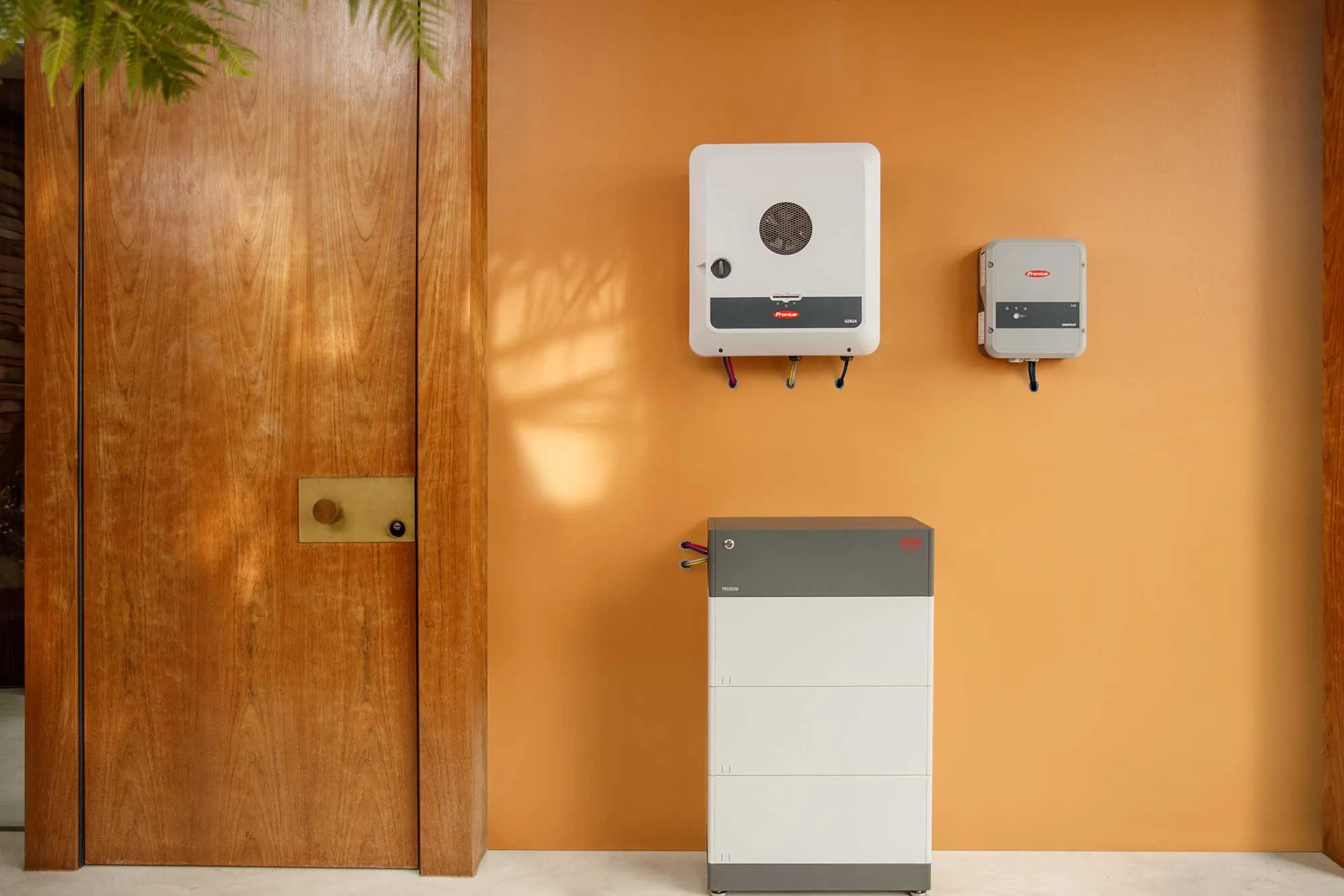 Fronius GEN24 hybrid and hybrid ready inverter range pictured with a BYD battery and Fronius Ohmpilot