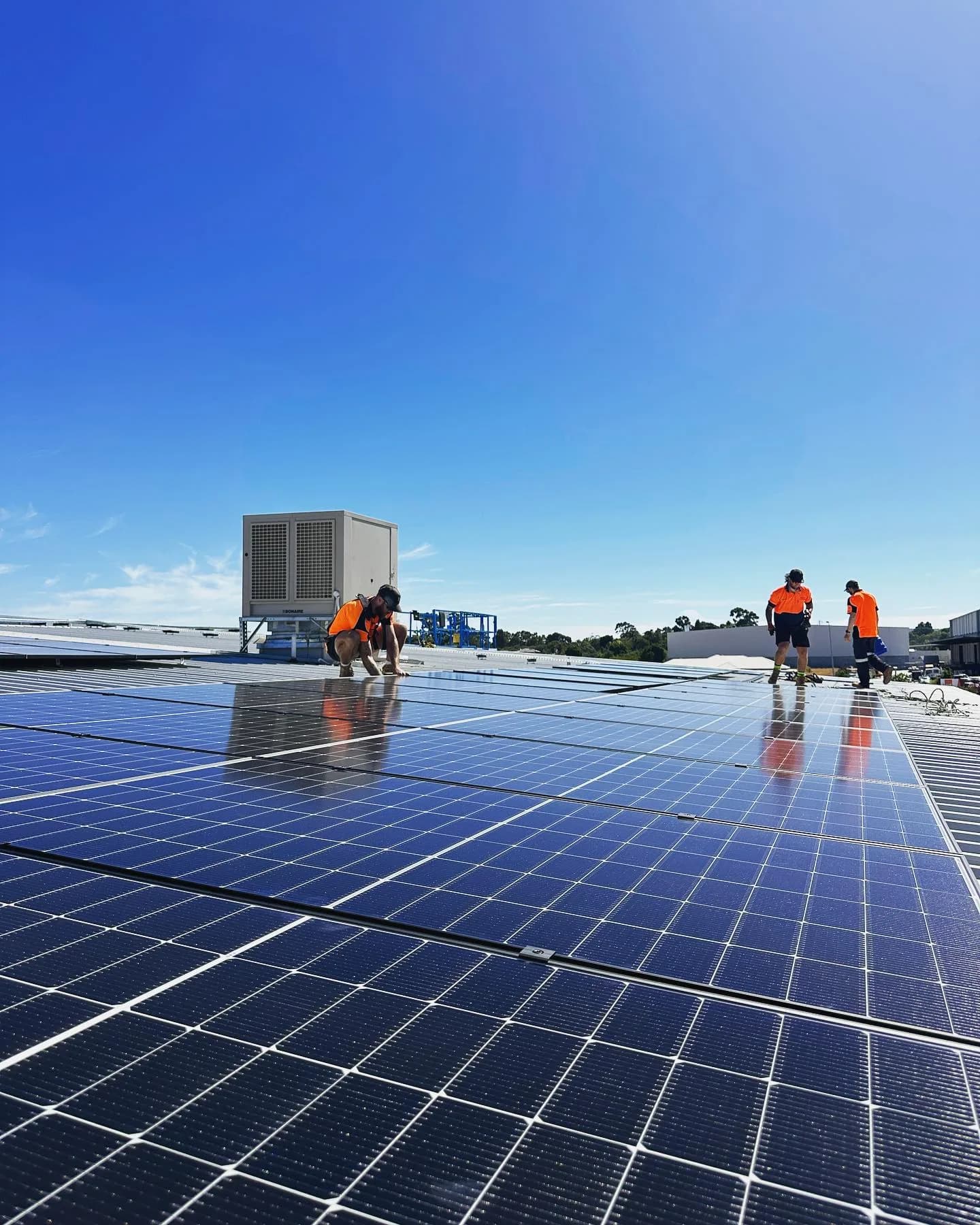 PSW installers working on a commercial solar rooftop in Perth